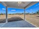 Covered patio offering an outdoor living space with a clear view of the expansive backyard at 308 Mayflower Dr., Calabash, NC 28467