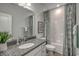 Stylish bathroom featuring a vanity with granite countertops and patterned shower curtain at 312 Mayflower Dr., Calabash, NC 28467