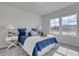 Bright bedroom featuring white furniture, a plush bed, and natural light from large windows at 312 Mayflower Dr., Calabash, NC 28467