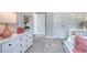 Bedroom with white dresser, soft carpet, and lots of natural light at 312 Mayflower Dr., Calabash, NC 28467