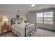 Bright bedroom with a view of new construction, complemented by a wrought iron bed at 312 Mayflower Dr., Calabash, NC 28467
