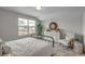 Bright bedroom with a window view, a large dresser, and a decorative armchair at 312 Mayflower Dr., Calabash, NC 28467