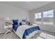 Bright bedroom with a queen bed, two end tables and lots of natural light at 312 Mayflower Dr., Calabash, NC 28467