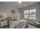 Comfortable bedroom with ample natural light, a decorative mirror, and stylish furniture at 312 Mayflower Dr., Calabash, NC 28467