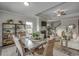Bright dining area with modern decor, fireplace, open floor plan, and plenty of natural light at 312 Mayflower Dr., Calabash, NC 28467
