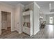 Neat entryway with built-in storage, decorative rug, and easy access to the rest of the home at 312 Mayflower Dr., Calabash, NC 28467