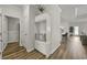 View of home entryway featuring hardwood floors and a built-in storage bench at 312 Mayflower Dr., Calabash, NC 28467