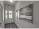 Inviting entryway with neutral paint, an artistic rug, and decorative paintings at 312 Mayflower Dr., Calabash, NC 28467