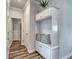 Inviting entryway featuring built-in storage, hooks, and a seating area with pillows at 312 Mayflower Dr., Calabash, NC 28467