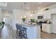 Stylish kitchen featuring a granite island with seating and white cabinets, perfect for modern living at 312 Mayflower Dr., Calabash, NC 28467