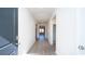 Inviting hallway with neutral walls and wood-look flooring, leading to the living areas at 327 Clear Lake Dr., Conway, SC 29526