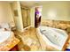 Bathroom featuring a shower, jacuzzi, large counterspace, and a beige tile finish at 3302 Highway 905, Conway, SC 29526