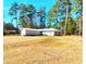 Ranch-style home with large lawn, located on a well-wooded lot at 3302 Highway 905, Conway, SC 29526