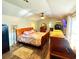 Spacious bedroom with hardwood floors, ceiling fan, a cozy quilt, and lots of room for furniture at 3302 Highway 905, Conway, SC 29526