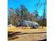 Quonset hut perfect for equipment or storage, nestled in a grassy lot surrounded by tall trees at 3302 Highway 905, Conway, SC 29526