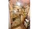 Modern shower featuring decorative tile, glass enclosure, a pebble floor, and a convenient built-in bench at 3302 Highway 905, Conway, SC 29526