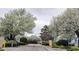 Picturesque neighborhood entrance, blossoming trees line the street of well maintained townhomes at 3700 Golf Colony Lane # 10C, Little River, SC 29566