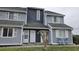 Inviting multi-story condo building featuring neutral siding, well-maintained landscape, and covered entrances at 3700 Golf Colony Lane # 10C, Little River, SC 29566