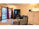 Cozy living room with comfortable seating, tv, and sliding glass doors to the outside porch at 3700 Golf Colony Lane # 10C, Little River, SC 29566