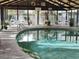 Bright indoor pool area with plentiful lounge chairs at 3700 Golf Colony Lane # 10C, Little River, SC 29566