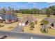 Aerial view of a brick home overlooking the Long Bay Club golf course at 387 Foxtail Dr., Longs, SC 29568