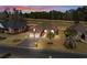 Aerial view of home with golf course in the background at dusk at 387 Foxtail Dr., Longs, SC 29568