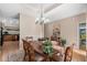 Dining room featuring an elegant chandelier and seating for six at 387 Foxtail Dr., Longs, SC 29568