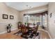 Inviting dining area featuring a bay window and decorative lighting at 387 Foxtail Dr., Longs, SC 29568