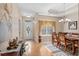 Dining room features a dining table, hardwood floors, and a gorgeous lighting fixture at 387 Foxtail Dr., Longs, SC 29568