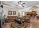 The living room features hardwood floors, neutral colors, two sofas, and a ceiling fan for added comfort at 387 Foxtail Dr., Longs, SC 29568