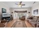 Comfortable living room with large windows and a ceiling fan at 387 Foxtail Dr., Longs, SC 29568