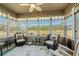 Cozy sunroom with golf course views, ceiling fan, and comfortable seating at 387 Foxtail Dr., Longs, SC 29568