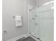 Modern bathroom featuring a clear glass shower with white tile, contemporary fixtures, and stylish accessories at 395 S Crow Creek Dr. # 1704, Calabash, NC 28467