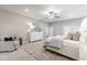 Beautiful bedroom featuring neutral decor, large windows, ceiling fan, and a comfortable seating area at 395 S Crow Creek Dr. # 1704, Calabash, NC 28467
