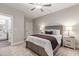 Comfortable bedroom featuring a ceiling fan, and carpet, offering a serene living space at 395 S Crow Creek Dr. # 1704, Calabash, NC 28467