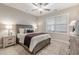 Cozy bedroom with a ceiling fan, carpet, window, and neutral-toned decor for a peaceful retreat at 395 S Crow Creek Dr. # 1704, Calabash, NC 28467
