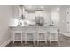Stylish kitchen features a large island with barstools and stainless steel appliances at 395 S Crow Creek Dr. # 1704, Calabash, NC 28467