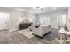 Bright, modern living room with ceiling fan and access to balcony at 395 S Crow Creek Dr. # 1704, Calabash, NC 28467