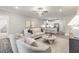 Cozy living room featuring an open floor plan to a modern kitchen with bar seating at 395 S Crow Creek Dr. # 1704, Calabash, NC 28467