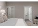 Partial view of a main bedroom leading to a walk-in closet and ensuite bathroom at 395 S Crow Creek Dr. # 1704, Calabash, NC 28467