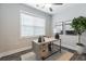 Bright office area with wood-style floors, a desk, natural light from window, and stylish decor at 395 S Crow Creek Dr. # 1704, Calabash, NC 28467