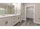 Bathroom featuring dual vanity with undermount sinks, sleek hardware, and modern finishes at 395 S Crow Creek Dr. # 1709, Calabash, NC 28467