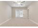 Bedroom with soft carpeting, ceiling fan, and sliding doors to the outside at 395 S Crow Creek Dr. # 1709, Calabash, NC 28467