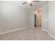 Bright bedroom featuring plush carpeting, a ceiling fan, and closet with white bi-fold doors at 395 S Crow Creek Dr. # 1709, Calabash, NC 28467