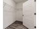 Walk-in closet with wire shelving and vinyl plank flooring at 395 S Crow Creek Dr. # 1709, Calabash, NC 28467