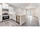 Modern kitchen boasts white cabinets, stainless steel appliances, and sleek countertops at 395 S Crow Creek Dr. # 1709, Calabash, NC 28467