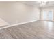 Living room view with modern flooring and patio doors for natural light at 395 S Crow Creek Dr. # 1709, Calabash, NC 28467
