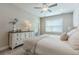 This bedroom features a window, carpet, and a dresser at 395 S Crow Creek Dr. # 1710, Calabash, NC 28467