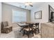 The dining room has a window and a dark wooden table with four chairs at 395 S Crow Creek Dr. # 1710, Calabash, NC 28467