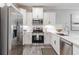 Bright kitchen with stainless steel appliances, white cabinetry, and modern countertops at 395 S Crow Creek Dr. # 1710, Calabash, NC 28467